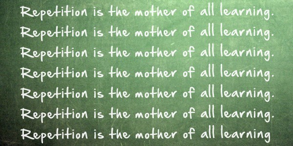 repetition_is_the_mother_of_all_learning_written_on_chalkboard